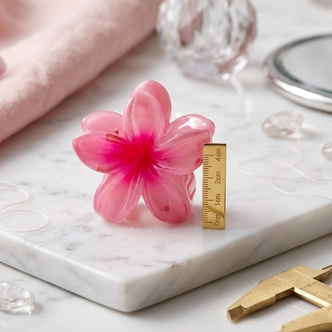 Elevate your everyday hairstyle with a touch of island paradise. This vibrant collection of plumeria-shaped hair claws brings the effortless beauty of the tropics directly to your vanity.